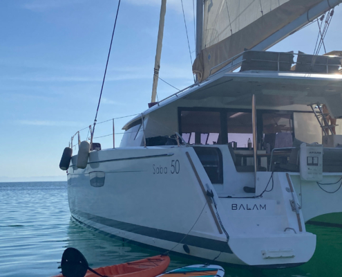 SUPs secured on deck and fins/masks ready.