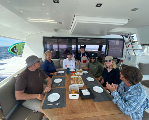 Overhead view of guests sharing appetizers at the outdoor table.